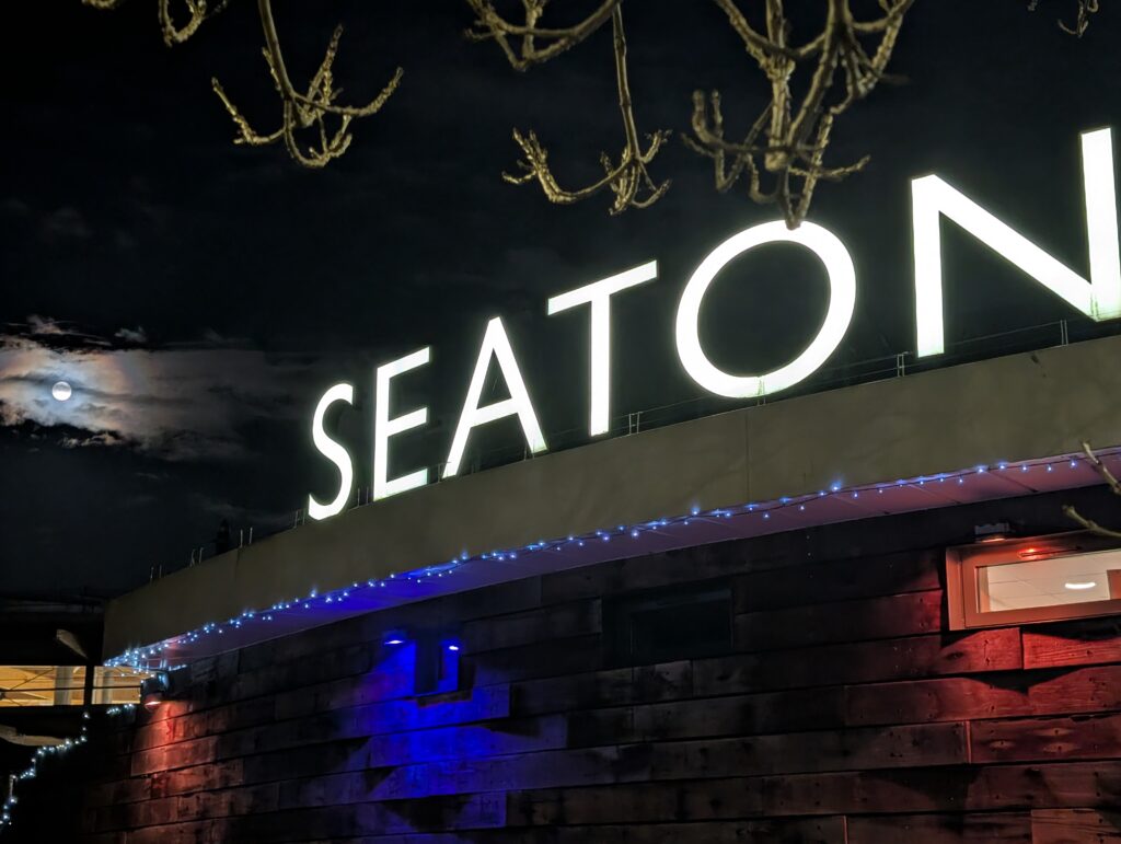 Seaton Tramway sign with full moon in the background