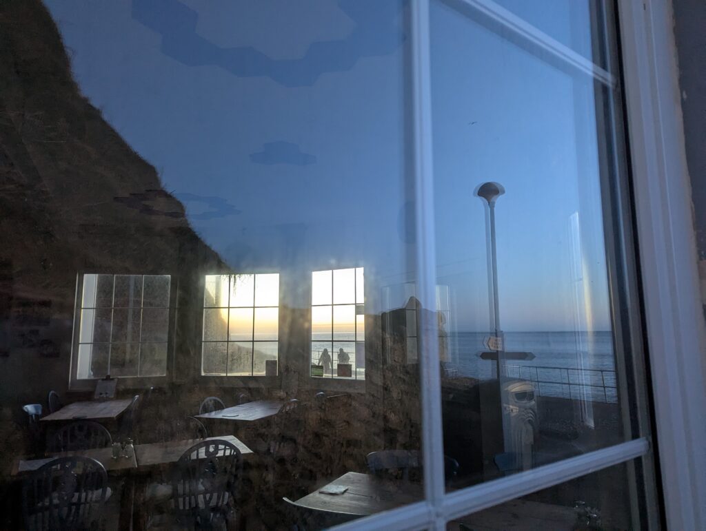 View into a cafe through window with reflections