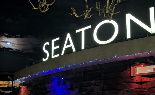 Seaton Tramway sign with full moon in the background